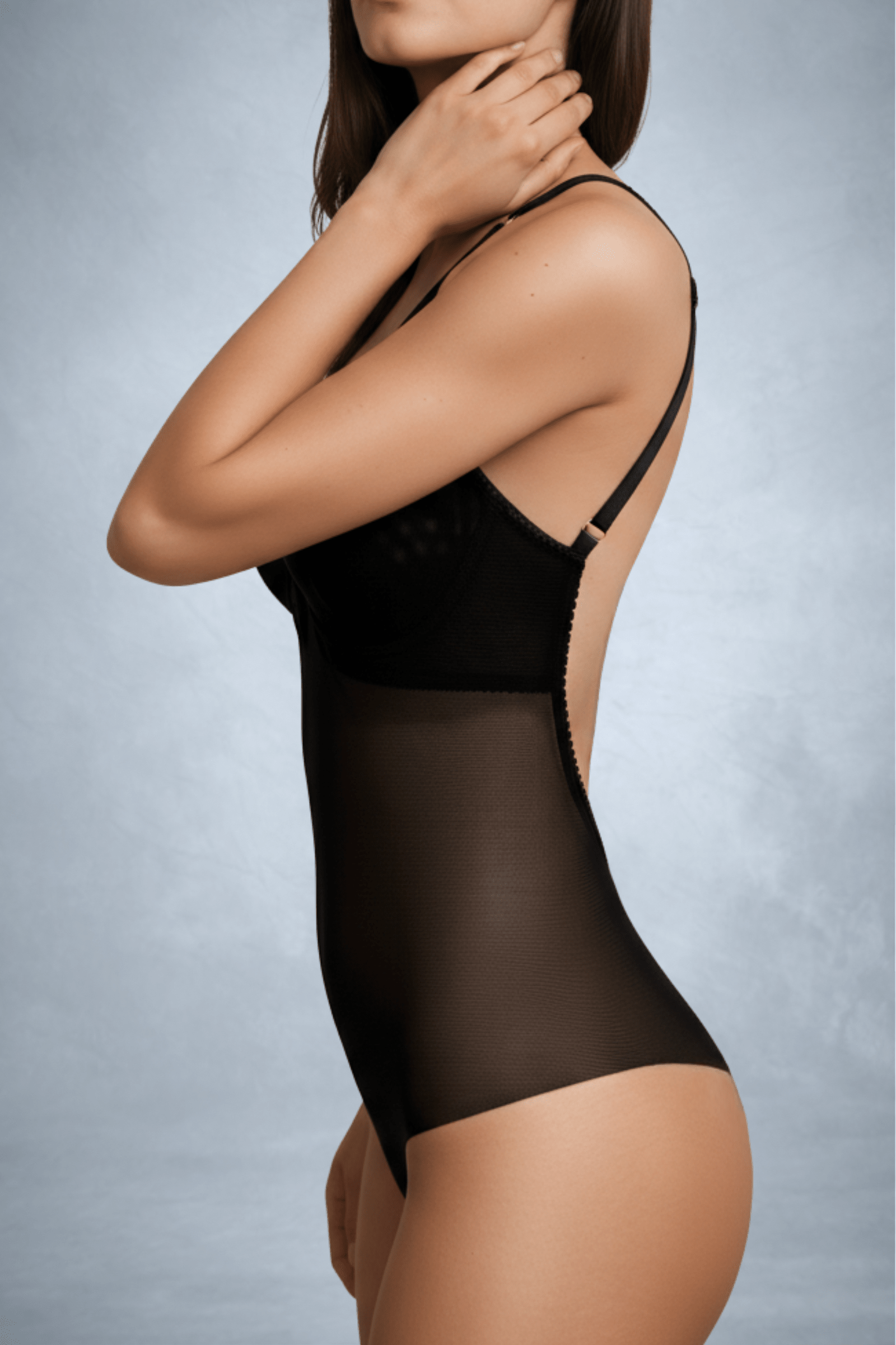 Side view of a faceless woman wearing a Backless and seamless lingerie shaper in black mesh with high apex cups for low back dress | ENDER LEGARD