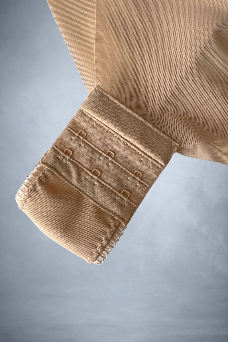 Adjustable hook and eye closure on MAE bodysuit gusset for bridal convenience and comfort.