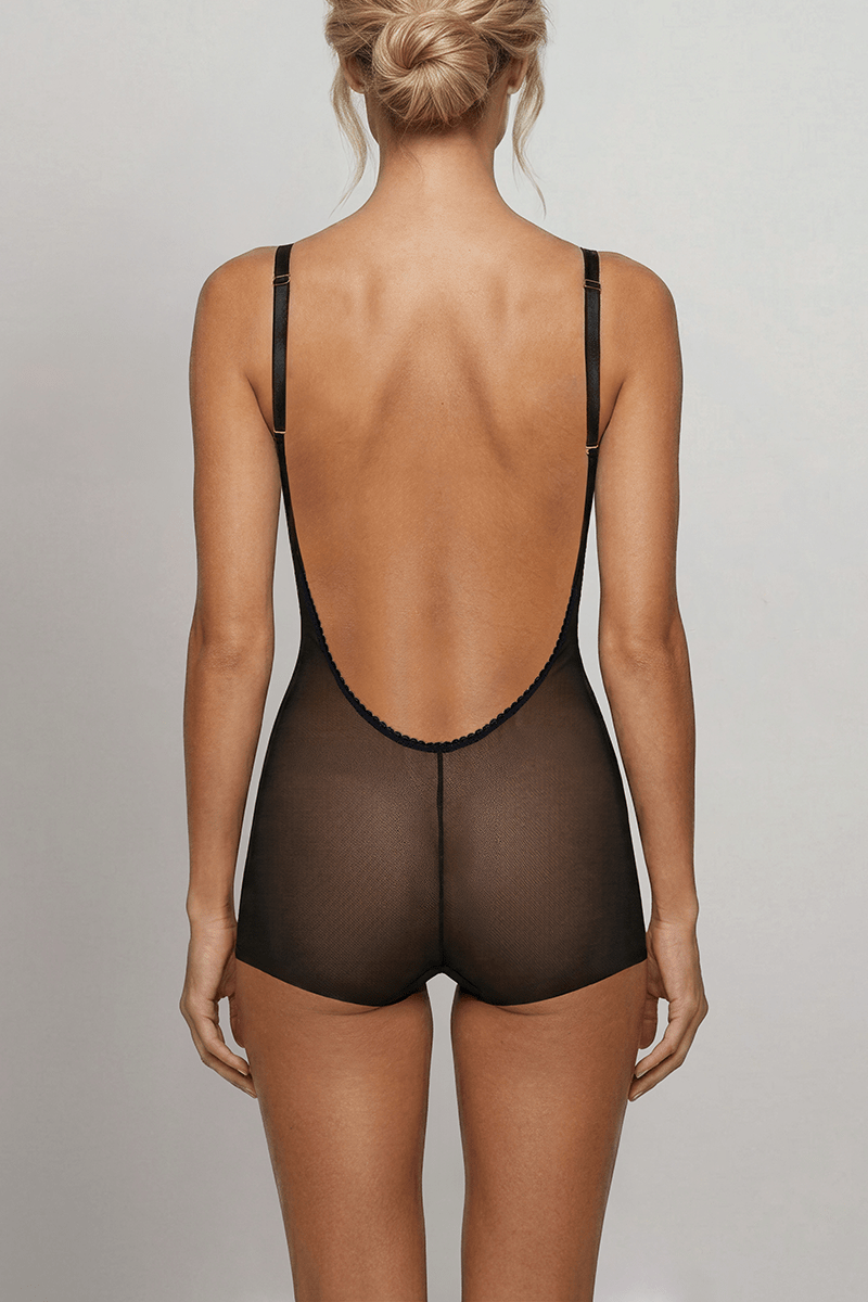 Back view of the Ender Legard KYA Black backless bodysuit showing adjustable shoulder straps, the ultra-low open back with no conventional bra back band, centre-back seam and full briefs with flat leg edges.