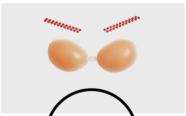Adhesive silicone bra cups cover with red lines and a black circle on a white background to create an angry face animation