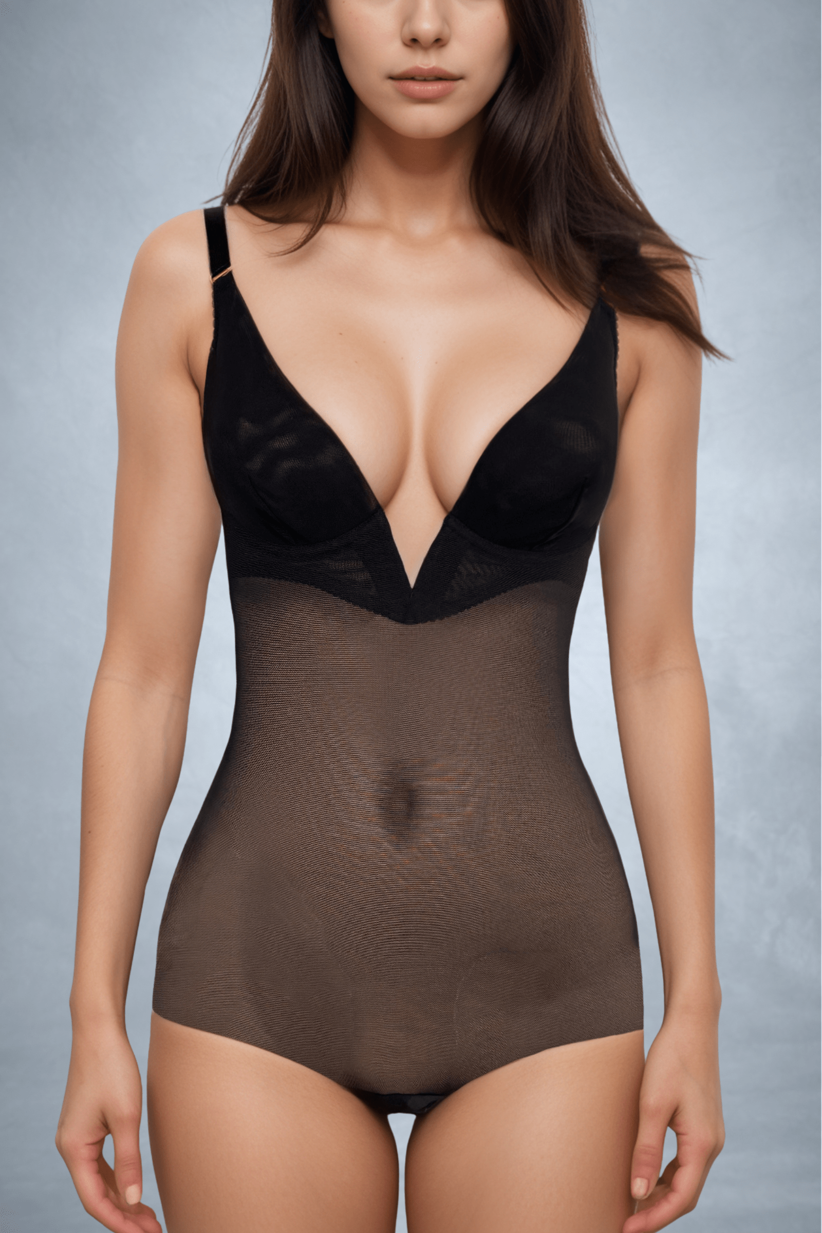 Woman wearing a handmade black plunge neck backless bodysuit with integrated boy shorts by ENDER LEGARD.