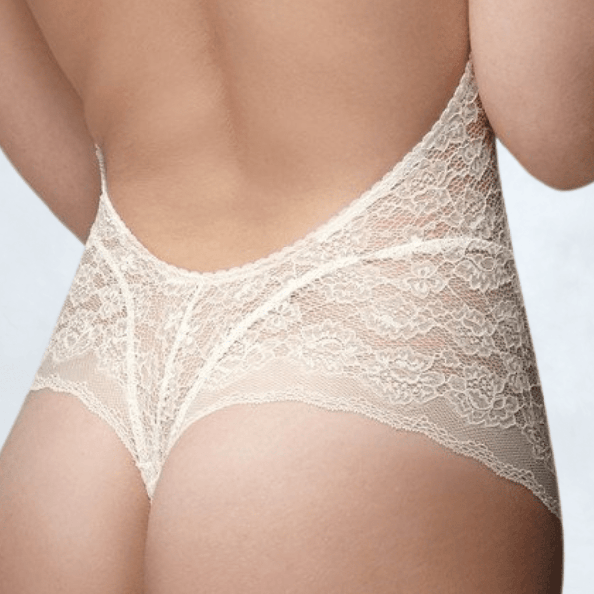 Close-up of the Ender Legard HOLLY Ivory back showing the ultra-low back and scalloped lace edge of the tanga briefs.