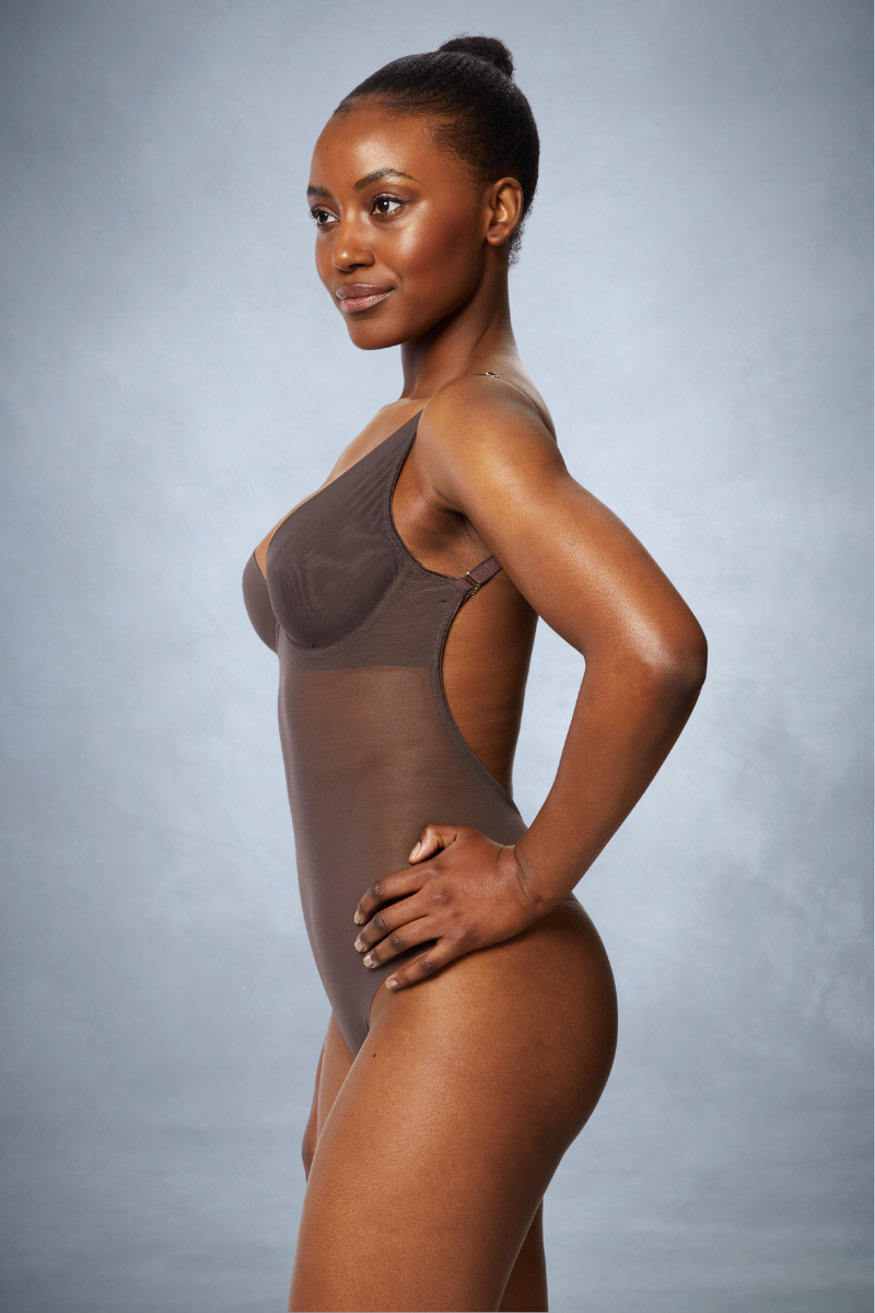 Ender Legard JONI Brown backless bodysuit, side view showing the cup's profile at the underarm and how far forward the open back extends.