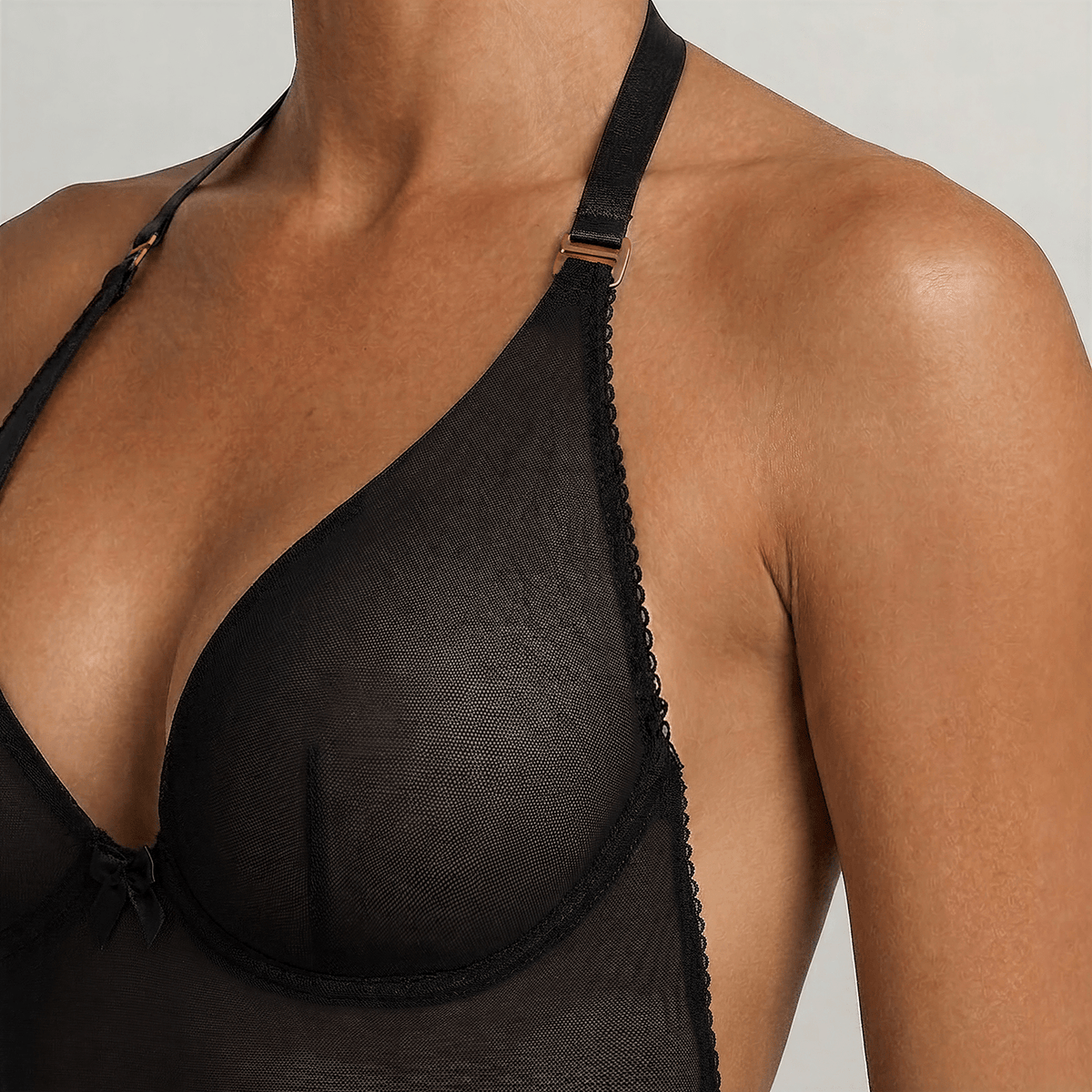 Close-up of the LEXI Black backless bodysuit cup, showing the underwired construction and the gold-toned strap adjuster.