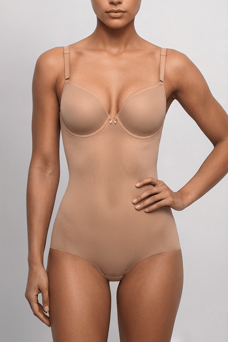 SIA Nude backless bodysuit, front view showing the moulded balconette cups, centre bow, adjustable shoulder straps and full brief cut.