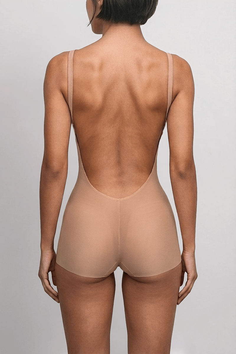 Ender Legard SIA Nude backless bodysuit, back view showing the low-back cut below the natural waistline with no bra back band, and the full-brief coverage.