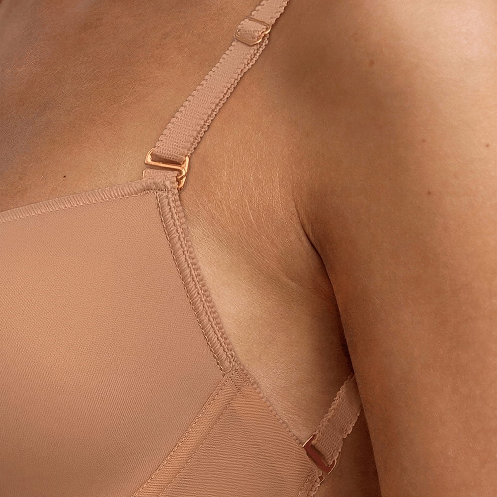 SIA Nude backless bodysuit close-up of the shoulder strap, showing the gold-toned adjuster and hook where it attaches to the cup.
