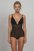 Ender Legard KYA Black backless bodysuit worn on a model, moving from a front view of the underwired soft cups, flat V-separator at the deep centre front and full-brief front through side views to the ultra-low back with no conventional bra back band.