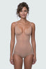 Ender Legard KYA Nude backless bodysuit worn on a model, moving from a front view of the underwired soft cups, flat V-separator at the deep centre front and full-brief front through the side profile to the ultra-low back with no conventional bra back band.