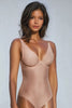 Front view video of a woman wearing a plunge front backless lingerie bodysuit by Ender Legard