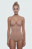 Ender Legard SIA Nude backless bodysuit shown in motion from front through side to back, demonstrating the seamless cup, no bra back band, ultra-low back and full-brief coverage.