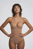 Ender Legard MAE Nude backless bodysuit in motion, worn alone and then under an open-back dress, showing the moulded cup fit and the smooth, band-free low back.